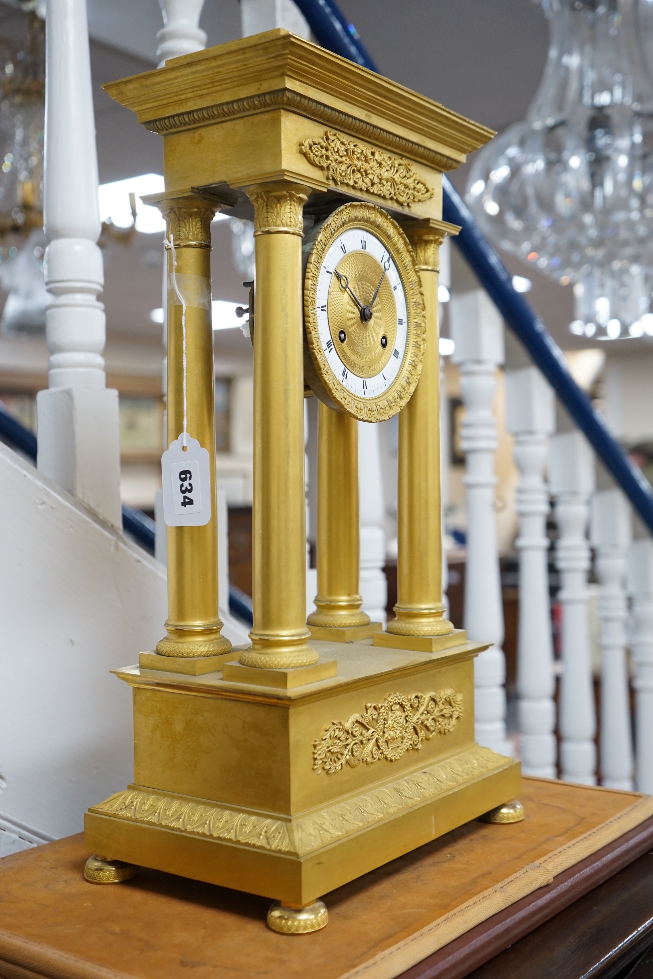 A large mid 19th century French ormolu portico clock. 49cm tall